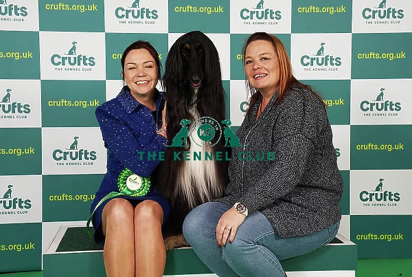 Claire Millward and Liz Millward from Sheffield with Alfie, an Afghan Hound, which was the Best of Breed winner today (Saturday 11. 03. 23), the third day of Crufts 2023, at the NEC Birmingham