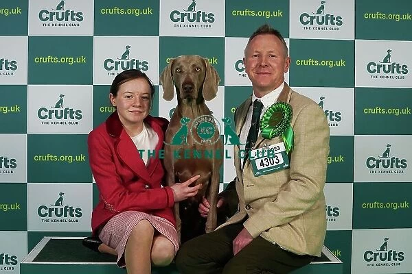 Dearbhla and Colin Nugent from Armagh with Didi, a Weimaraner, which was the Best of Breed winner today (Thursday 09. 03. 23), the first day of Crufts 2023, at the NEC Birmingham