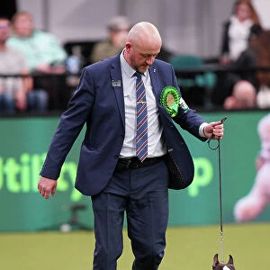 Dave Bennett from Liverpool, with Ted, a Boston Terrier, which was the Best of Breed winner today (Sunday 12. 03. 23), the last day of Crufts 2023, at the NEC Birmingham