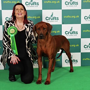 Jane Anthony from Northern Ireland with Khan, a Rhodesian Ridgeback, which was the Best of Breed winner today (Saturday 11. 03. 23), the third day of Crufts 2023, at the NEC Birmingham