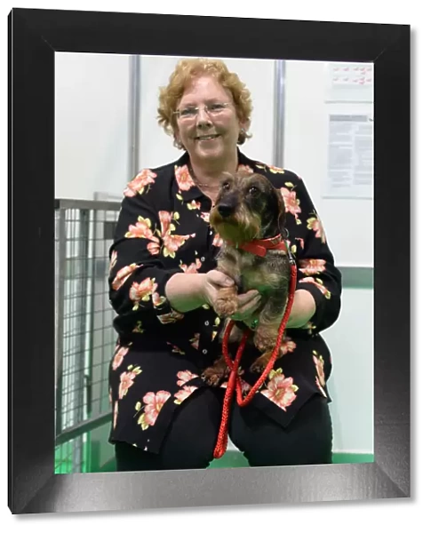 owner and her wirehaired dachshund at their discover dogs stand