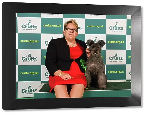 Michelle Smee from Bristol with Sunny, a Hungarian Pumi, which was the Best of Breed winner today (Friday 10. 03. 23), the second day of Crufts 2023, at the NEC Birmingham