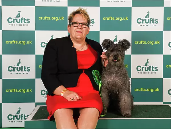 Michelle Smee from Bristol with Sunny, a Hungarian Pumi, which was the Best of Breed winner today (Friday 10. 03. 23), the second day of Crufts 2023, at the NEC Birmingham