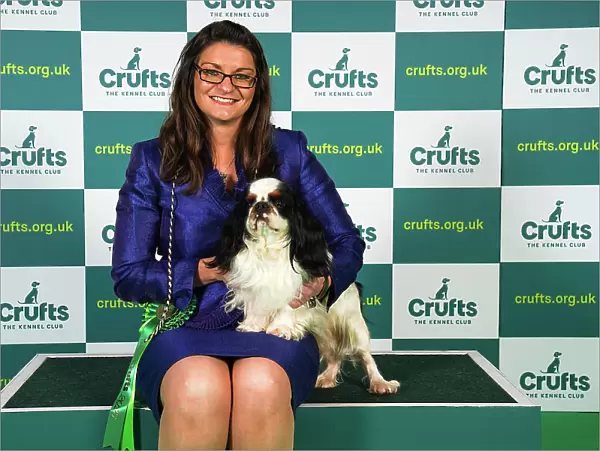 Kirsty Ryan from Lutterworth, with Riley, a King Charles Spaniel, which was the Best of Breed winner today (Sunday 12. 03. 23), the last day of Crufts 2023, at the NEC Birmingham