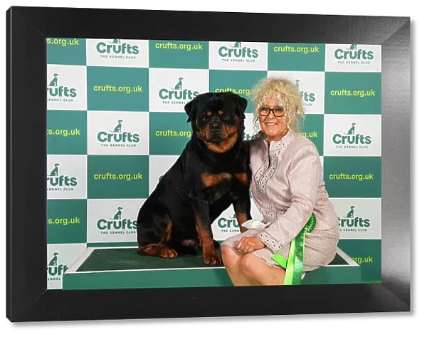 Liz Dunhill from Clumber Park with Dutch, a Rottweiler, which was the Best of Breed winner today (Friday 10. 03. 23), the second day of Crufts 2023, at the NEC Birmingham