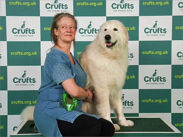 Jane Atkins from Carlisle with Saf, a Maremma Sheepdog, which was the Best of Breed winner today (Friday 10. 03. 23), the second day of Crufts 2023, at the NEC Birmingham