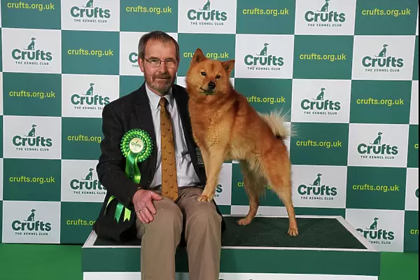 Julie Brown from Selsey with Herbie, a Airedale Terrier, which was the Best of Breed winner today (Saturday 11. 03. 23), the third day of Crufts 2023, at the NEC Birmingham