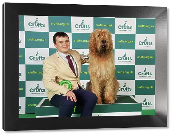 Robin Alner from Kidderminster with Dreadnaught, an Otterhound, which was the Best of Breed winner today (Saturday 11. 03. 23), the third day of Crufts 2023, at the NEC Birmingham