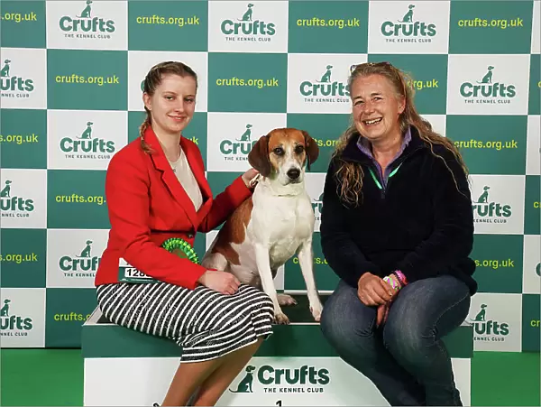 Alysha Branchflower and Charlotte Farrar from Bridgewater with Havoc, a Harrier, which was the Best of Breed winner today (Saturday 11. 03. 23), the third day of Crufts 2023, at the NEC Birmingham