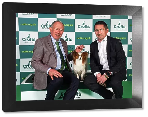 Sean Carrol and James Newman from Dublin, with Guiness, a Papillon, which was the Best of Breed winner today (Sunday 12. 03. 23), the last day of Crufts 2023, at the NEC Birmingham