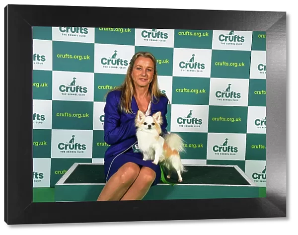 Irene Peeker from Sweden, with Million, a Chihuahua (Long Coat), which was the Best of Breed winner today (Sunday 12. 03. 23), the last day of Crufts 2023, at the NEC Birmingham