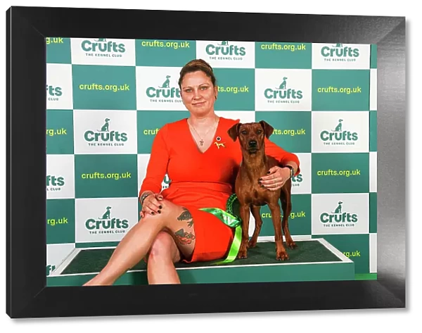 Yasmin Muthias from Germany with Effie, a German Pinscher, which was the Best of Breed winner today (Friday 10. 03. 23), the second day of Crufts 2023, at the NEC Birmingham
