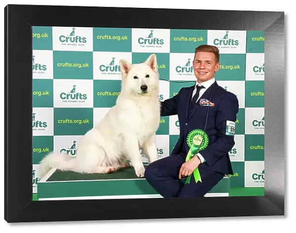 Tino Jalonen from Finland with Gero, a White Swiss Shepherd Dog, which was the Best of Breed winner today (Friday 10. 03. 23), the second day of Crufts 2023, at the NEC Birmingham