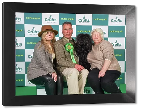 Shaun, Kelsey and Donna Dring from Wisbech with Creed, a Portuguese Water Dog, which was the Best of Breed winner today (Friday 10. 03. 23), the second day of Crufts 2023, at the NEC Birmingham
