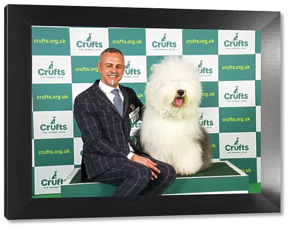 Nikolas Kanals Matteo Autolitano from Greece / Italy with Blondie, an Old English Sheepdog, which was the Best of Breed winner today (Friday 10. 03. 23), the second day of Crufts 2023, at the NEC Birmingham