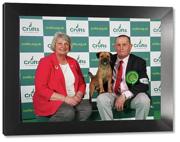 Hilary and Jimmy Gilpin from Arnside with Boots, a Border Terrier, which was the Best of Breed winner today (Saturday 11. 03. 23), the third day of Crufts 2023, at the NEC Birmingham