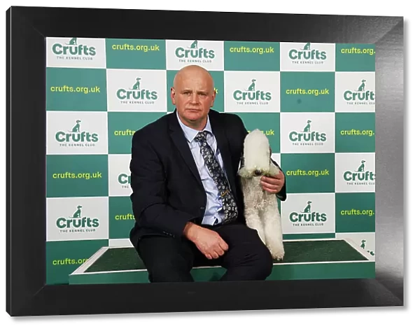 John McNally from Consett with Daisy, a Bedlington Terrier, which was the Best of Breed winner today (Saturday 11. 03. 23), the third day of Crufts 2023, at the NEC Birmingham