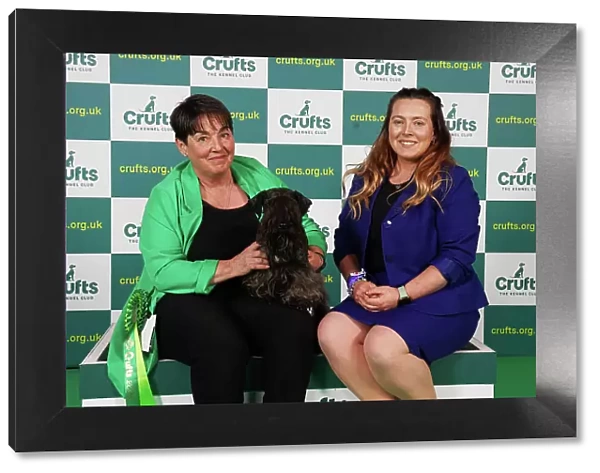 Karen and Caitlin Forbes from Garmouth with Houska, a Cesky Terrier, which was the Best of Breed winner today (Saturday 11. 03. 23), the third day of Crufts 2023, at the NEC Birmingham