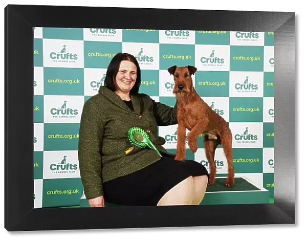 Karolin Schmidt from Germany with Dante, an Irish Terrier, which was the Best of Breed winner today (Saturday 11. 03. 23), the third day of Crufts 2023, at the NEC Birmingham