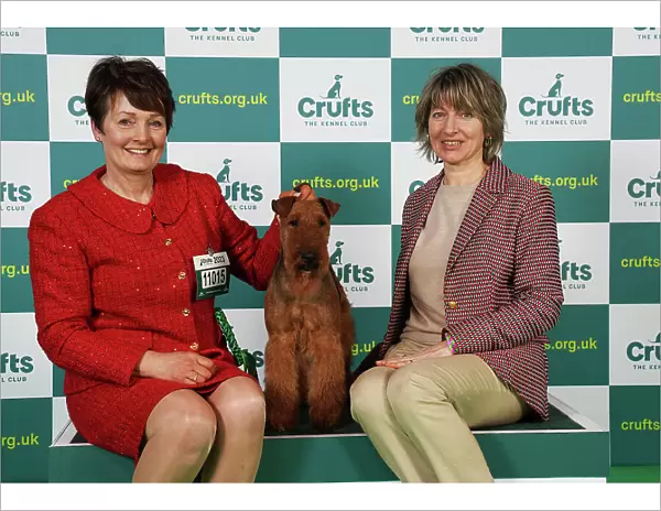 Joanne Vickers and Natalia Avveduti from Italy with Boris, an Irish Terrier, which was the Best of Breed winner today (Saturday 11. 03. 23), the third day of Crufts 2023, at the NEC Birmingham