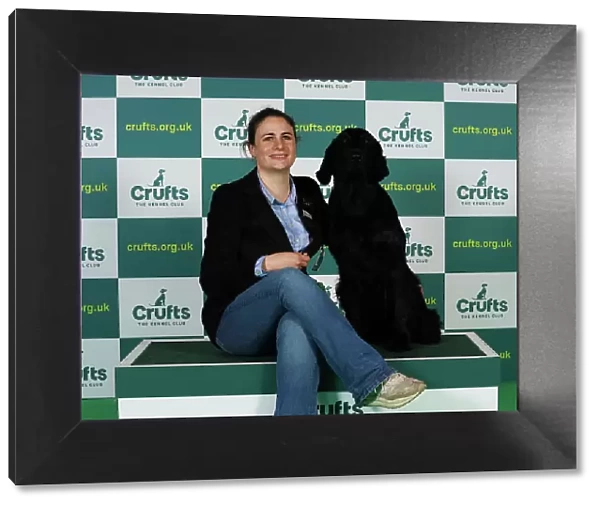 Ludovica Soresina from Italy with Chilkoot, a Retriever Flat Coated, which was the Best of Breed winner today (Thursday 09. 03. 23), the first day of Crufts 2023, at the NEC Birmingham
