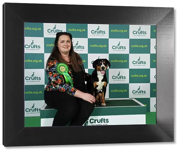 Emily English from Derby with Betty, an Entlebucher Mountain Dog, which was the Best of Breed winner today (Friday 10. 03. 23), the second day of Crufts 2023, at the NEC Birmingham