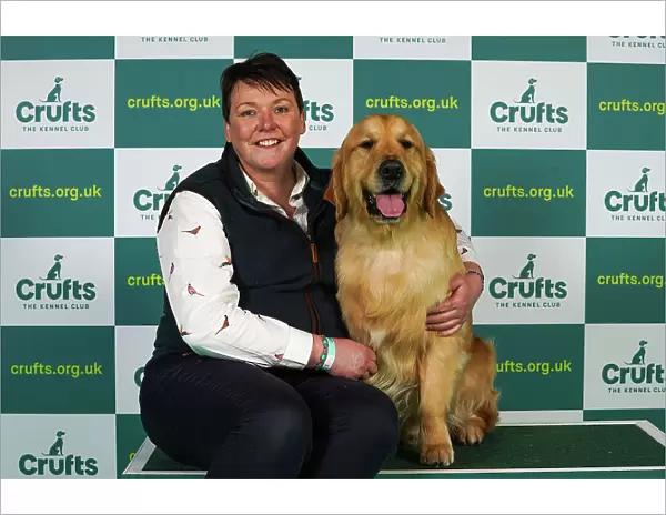 Katherina Savage from Wexford with Killian, a Golden Retriever, which was the Best of Breed winner today (Thursday 09. 03. 23), the first day of Crufts 2023, at the NEC Birmingham