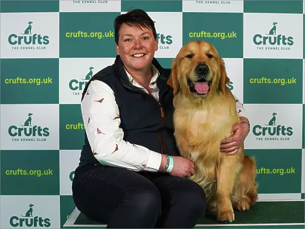 Katherina Savage from Wexford with Killian, a Golden Retriever, which was the Best of Breed winner today (Thursday 09. 03. 23), the first day of Crufts 2023, at the NEC Birmingham