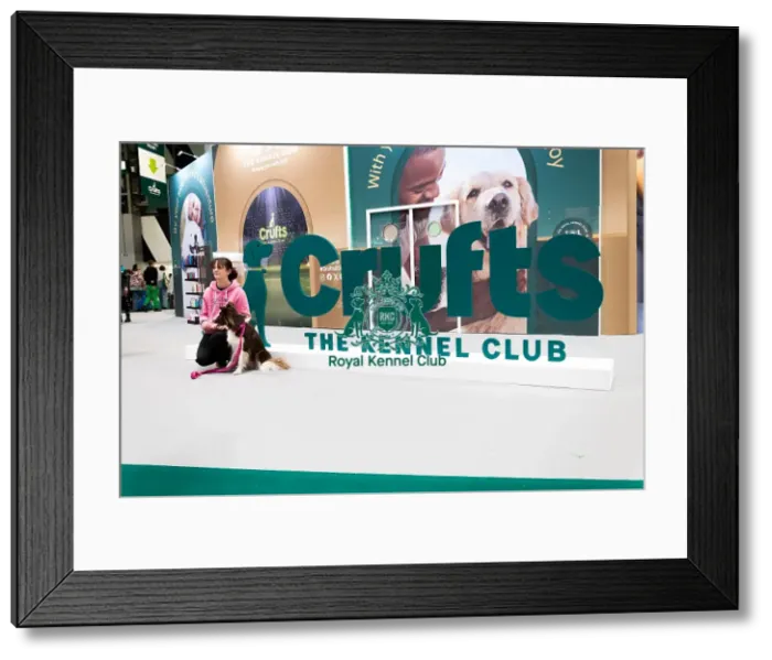 Framed Print : Owners Posing With Their Border Collie In Front Of The Crufts Banner Framed Print : Owners Posing With Their Border Collie In Front Of The Crufts Banner