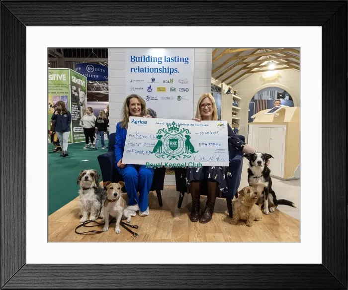 Framed Print : Jennifer Millard - Chair of the Kennel Club Charitable Trust is presented by with a cheque by Vicki Wentworth CEO AGRI