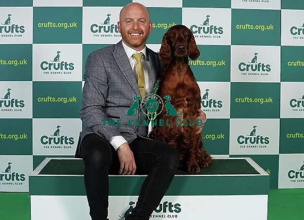 Blake Crocker from Somerset with Gloria, an Irish Setter, which was the Best of Breed winner today (Thursday 09. 03. 23), the first day of Crufts 2023, at the NEC Birmingham