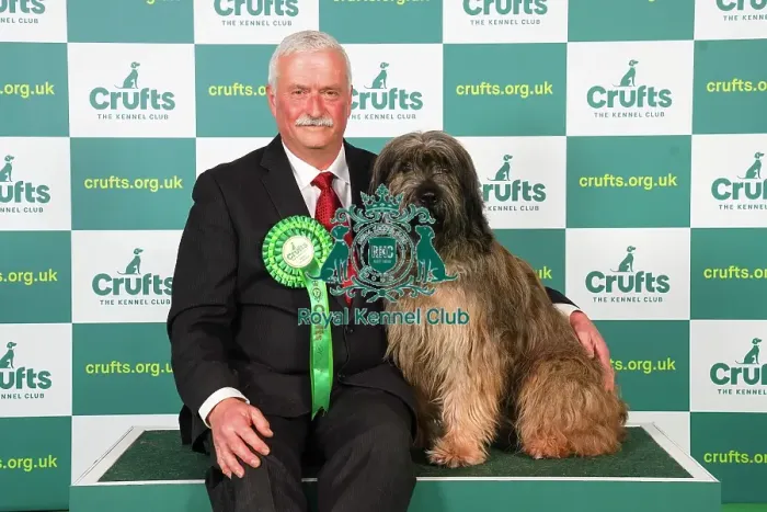 Framed Print : Brian Harper from Canada with Pacco, a Catalan Sheepdog, which was the Best of Breed winner today (Friday 10. 03. 23), the second day of Crufts 2023, at the NEC Birmingham