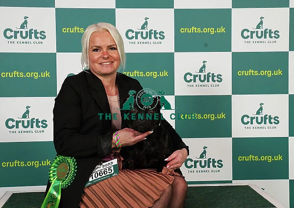 Catrine Arntzen from Norway with Lea, a Staffordshire Bull Terrier, which was the Best of Breed winner today (Saturday 11. 03. 23), the third day of Crufts 2023, at the NEC Birmingham
