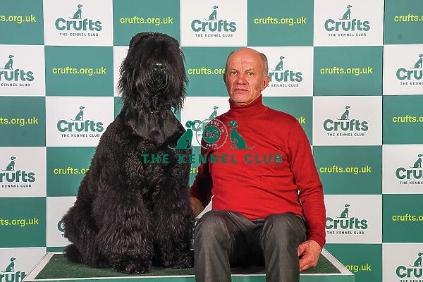 Cazemeaz Koss from Poland with Mazurzkifiat, a Russian Black Terrier, which was the Best of Breed winner today (Friday 10. 03. 23), the second day of Crufts 2023, at the NEC Birmingham