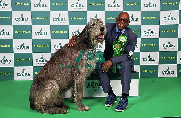Chris Amoo from Cheshire with Paris, an Irish Wolfhound, which was the Best of Breed winner today (Saturday 11. 03. 23), the third day of Crufts 2023, at the NEC Birmingham