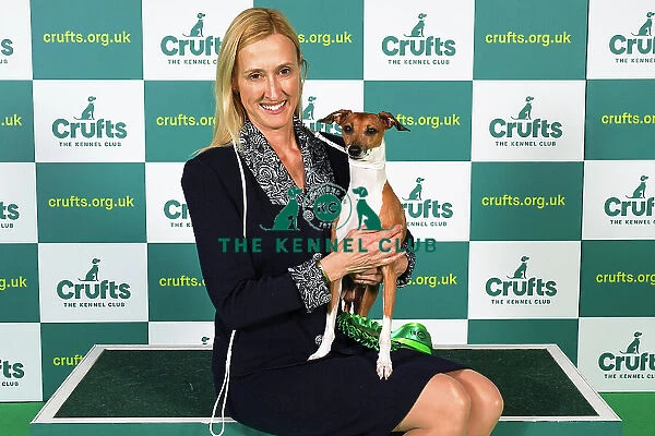 Dini Westerman from Canada, with Mojo, a Italian Greyhound, which was the Best of Breed winner today (Sunday 12. 03. 23), the last day of Crufts 2023, at the NEC Birmingham