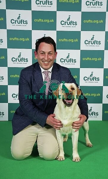 Ed Cassey from South Warwickshire with Ada, a Labrador, which was the Best of Breed winner today (Thursday 09. 03. 23), the first day of Crufts 2023, at the NEC Birmingham