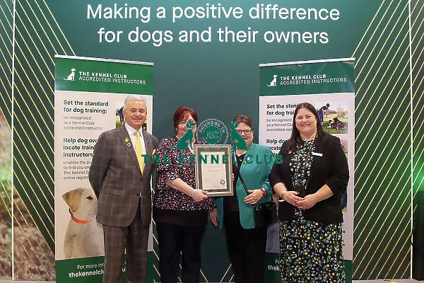 Emma Green receiving her KCAI certificate for the Kennel Club Accredited Training Scheme with Paul Rawlings, Helen Kerfoot and Angela White, KCAI Vice Chair