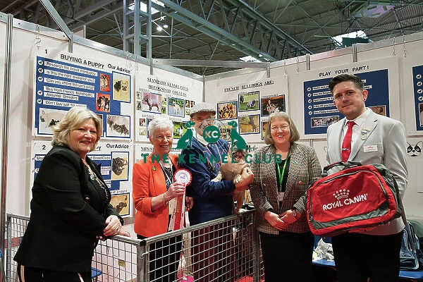 The French Bulldog Club being awarded the Best Discover Dogs Stand for the Utility Group at Crufts on Sunday 10th March 2024 by Alison Scutcher, Nicky Ackerley-Kemp (Directors at The Kennel Club) and Ricky Furnell from Royal Canin