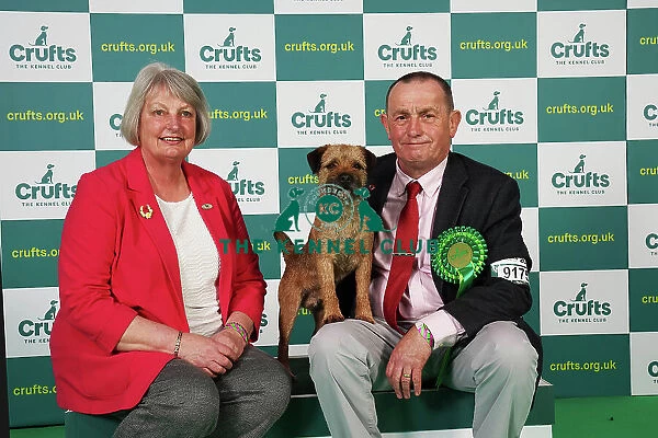 Hilary and Jimmy Gilpin from Arnside with Boots, a Border Terrier, which was the Best of Breed winner today (Saturday 11. 03. 23), the third day of Crufts 2023, at the NEC Birmingham