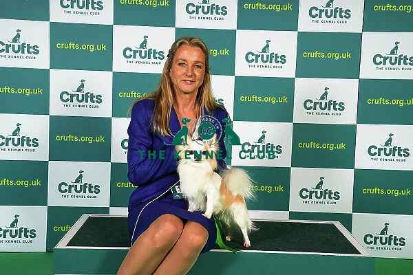 Irene Peeker from Sweden, with Million, a Chihuahua (Long Coat), which was the Best of Breed winner today (Sunday 12. 03. 23), the last day of Crufts 2023, at the NEC Birmingham