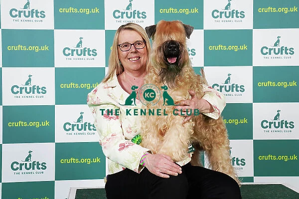 Jo Dowdy from Northampton with Hendricks, a Soft Coated Wheaten Terrier, which was the Best of Breed winner today (Saturday 11. 03. 23), the third day of Crufts 2023, at the NEC Birmingham