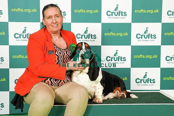 Liz Cudlip from County Durham with Bruce, a Basset Hound, which was the Best of Breed winner today (Saturday 11. 03. 23), the third day of Crufts 2023, at the NEC Birmingham