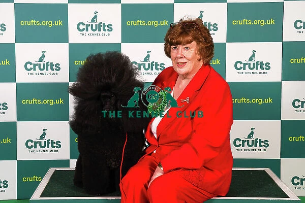 Liz Holmes-Loak from Bradford, with Lewis, a Poodle (Miniature), which was the Best of Breed winner today (Sunday 12. 03. 23), the last day of Crufts 2023, at the NEC Birmingham