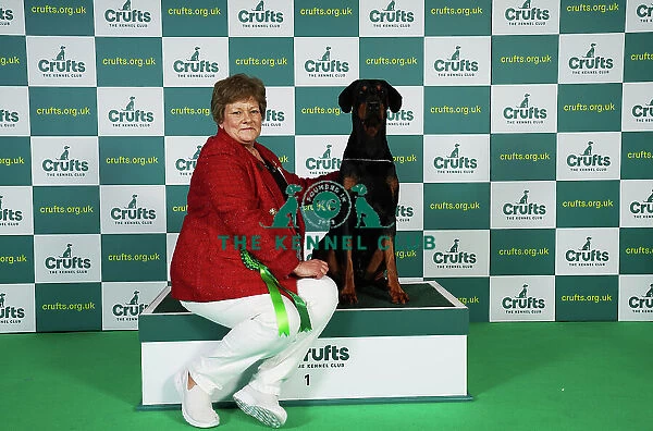 Mandy Everley from West Sussex with Archie, a Doberman, which was the Best of Breed winner today (Friday 10. 03. 23), the second day of Crufts 2023, at the NEC Birmingham