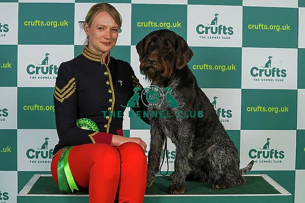 Nicki Johnston from Colchester with Zena, a German Wirehaired Pointer, which was the Best of Breed winner today (Thursday 09. 03. 23), the first day of Crufts 2023, at the NEC Birmingham