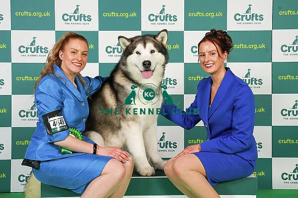 Rochelle and Jessica Smith from Taunton with Zane, an Alaskan Malamute, which was the Best of Breed winner today (Friday 10. 03. 23), the second day of Crufts 2023, at the NEC Birmingham