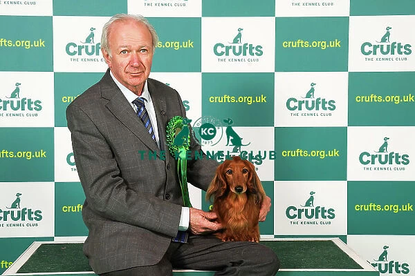 Roy Wood from Norwich with Robin, a Dachshund (Miniature Long Haired), which was the Best of Breed winner today (Saturday 11. 03. 23), the third day of Crufts 2023, at the NEC Birmingham