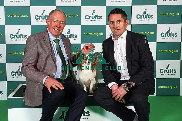 Sean Carrol and James Newman from Dublin, with Guiness, a Papillon, which was the Best of Breed winner today (Sunday 12. 03. 23), the last day of Crufts 2023, at the NEC Birmingham