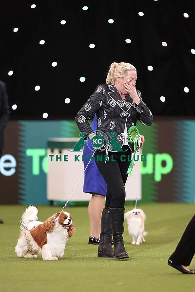 Tanya Ireland from Essex, with Dublin, a Cavalier King Charles Spaniel, which was the Best in Group winner today (Sunday 12. 03. 23), the last day of Crufts 2023, at the NEC Birmingham. Tanya Ireland from Essex, with Dublin